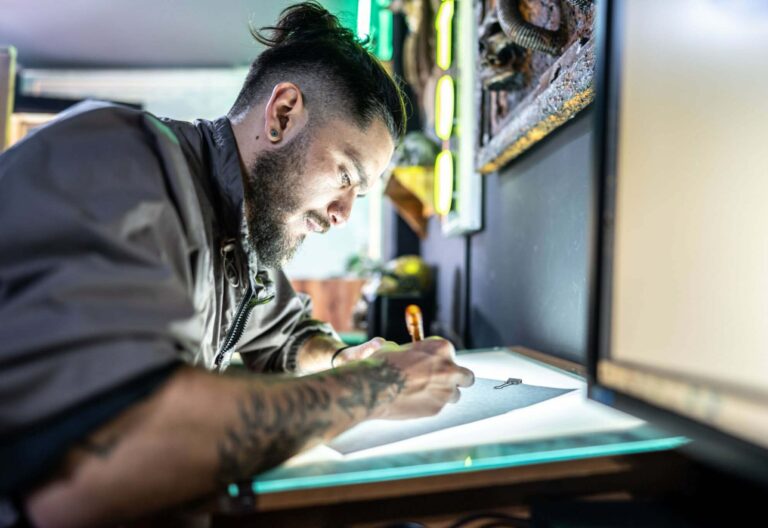 Why is it important to get a good design from a tattoo designer before going to a tattoo shop to get a tattoo?